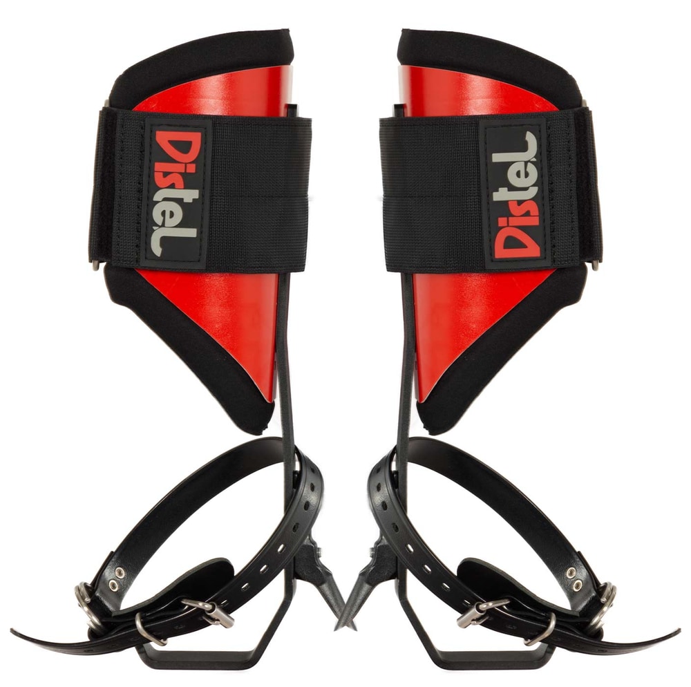 Distel Steel Classic, two red and black metal spur shoes with black straps and the lettering "Distel" on the black Velcro fasteners
