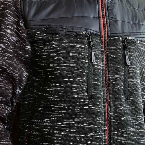 Close-up of black Inuit winter jacket with two vertical chest pockets with zipper