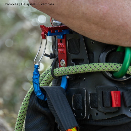skyHOOK Wire Gate in blue and red on black climbing harness with green climbing line and arm in the background