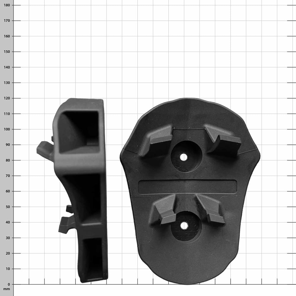 Toolprotect helmet holder, one black plastic part from the front and another from the side against a checkered background