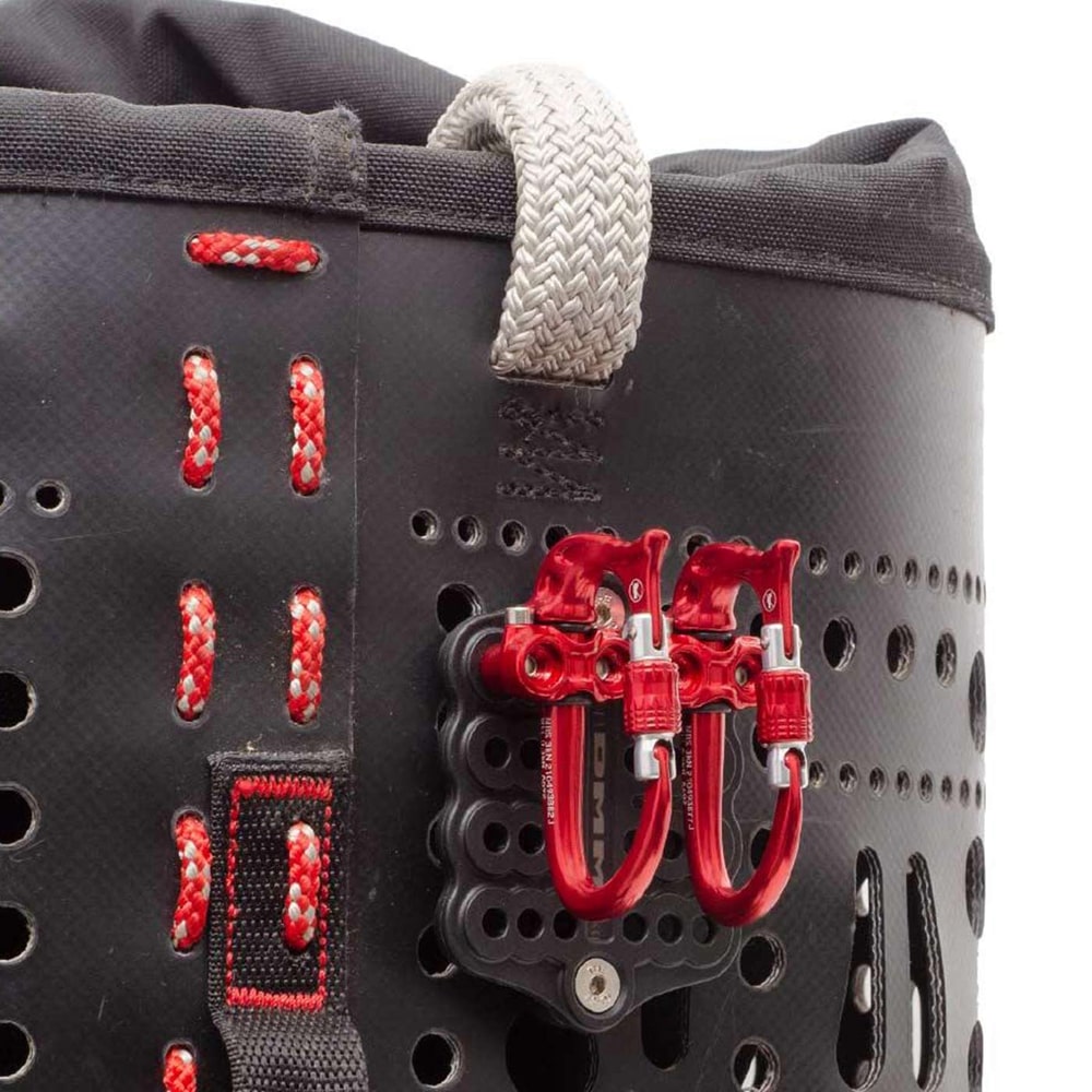 Micro Vault by DMM, two red carabiners with screw cap attached to a black bracket with red stitching