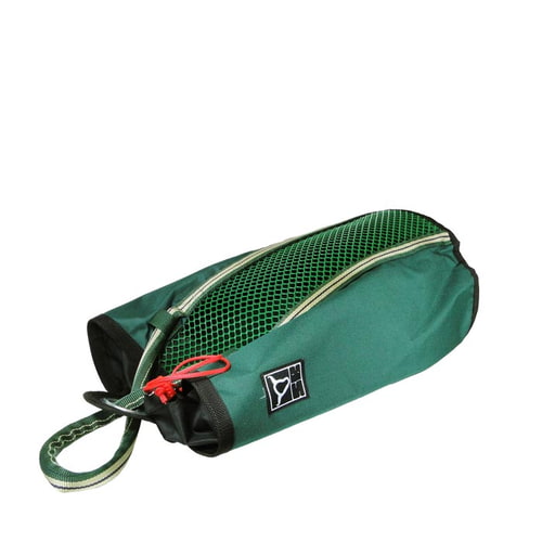 Grab Bag 20, green bag with black edge, mesh compartment on the top, red drawstring and carrying strap, lying