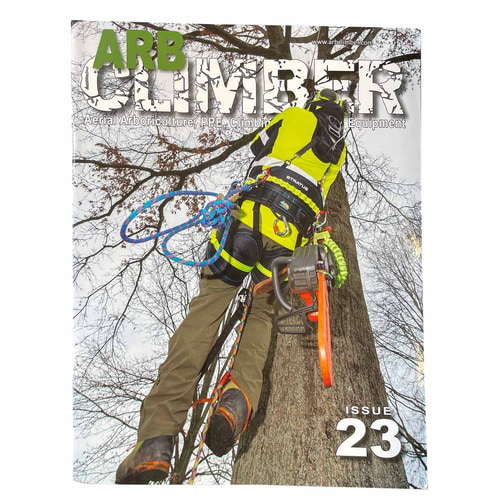 Arb Climber No. 23 magazine with a climber in yellow protective clothing on a tree trunk, chainsaw on the side, title in large letters at the top and issue number 23 at the bottom right