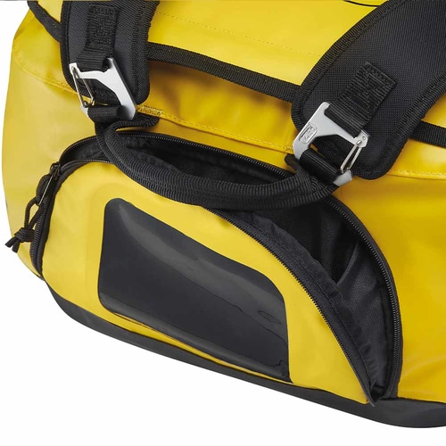 Close-up of black zippers and metal closures of yellow PETZL Duffel 65 bag