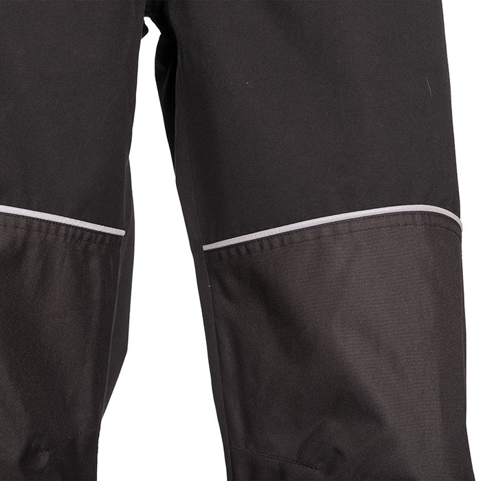 Close-up of the knees of the Keiu rain pants with gray inserts and reflective stripes