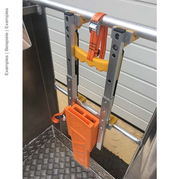 Attachment adapter work basket Premium mounted on a metal railing with orange strap and an orange tool holder, manufacturer not visible