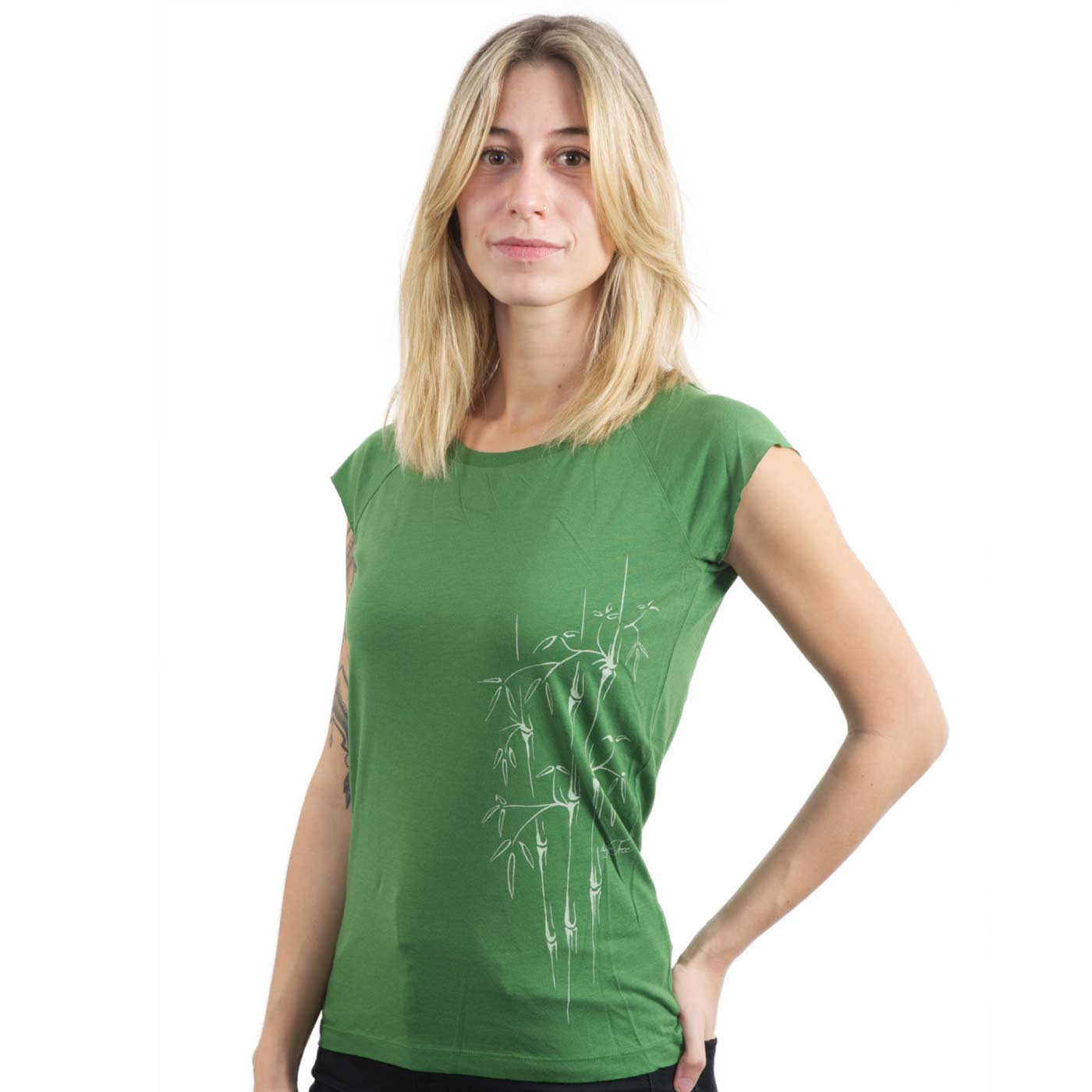 Green T-shirt with short sleeves and white bamboo print on the left side, model wearing the shirt, product name Bamboo