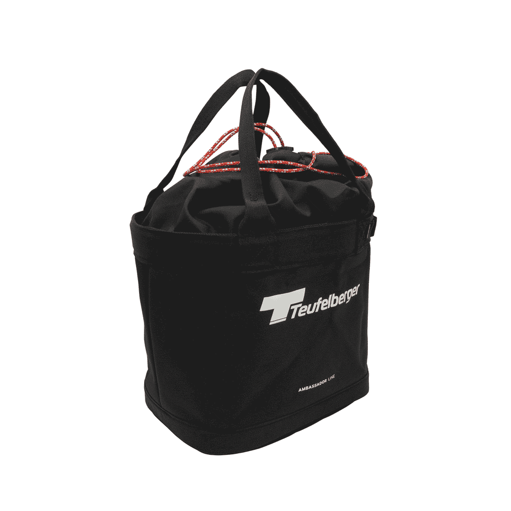 Bucket Mule by Teufelberger, black round bag with two black handles and red cord closure, front with white Teufelberger logo and lettering "AMBASSADOR LINE"