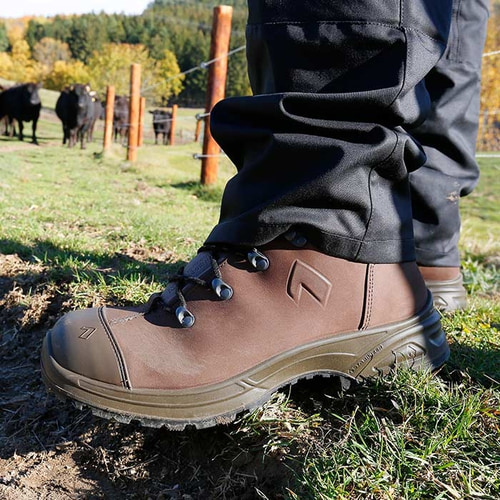 Airpower XR26 brown work shoe on one foot with black trousers, manufacturer's name not visible