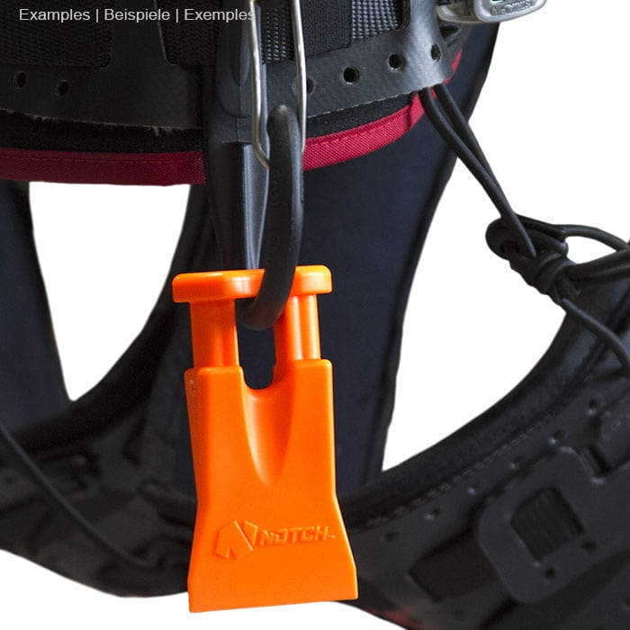Climbers Best Friend Wedge by Notch, orange plastic wedge with two short rods hangs on black climbing harness with red accents