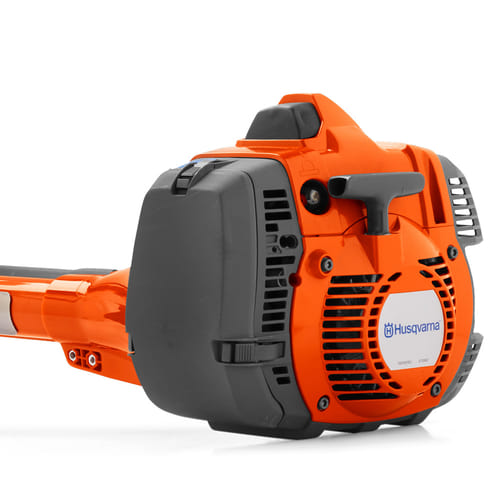 Close-up of the orange engine of the Husqvarna 545RXT AutoTune with black air filter housing and Husqvarna logo