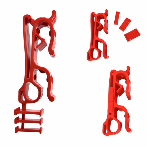 Buddy red plastic clip with three small red plastic pieces, two clips and three small rectangular pieces on white background