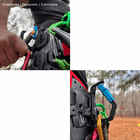 Man with climbing equipment attaches a blue swinger snap hook to a black belt with more carabiners