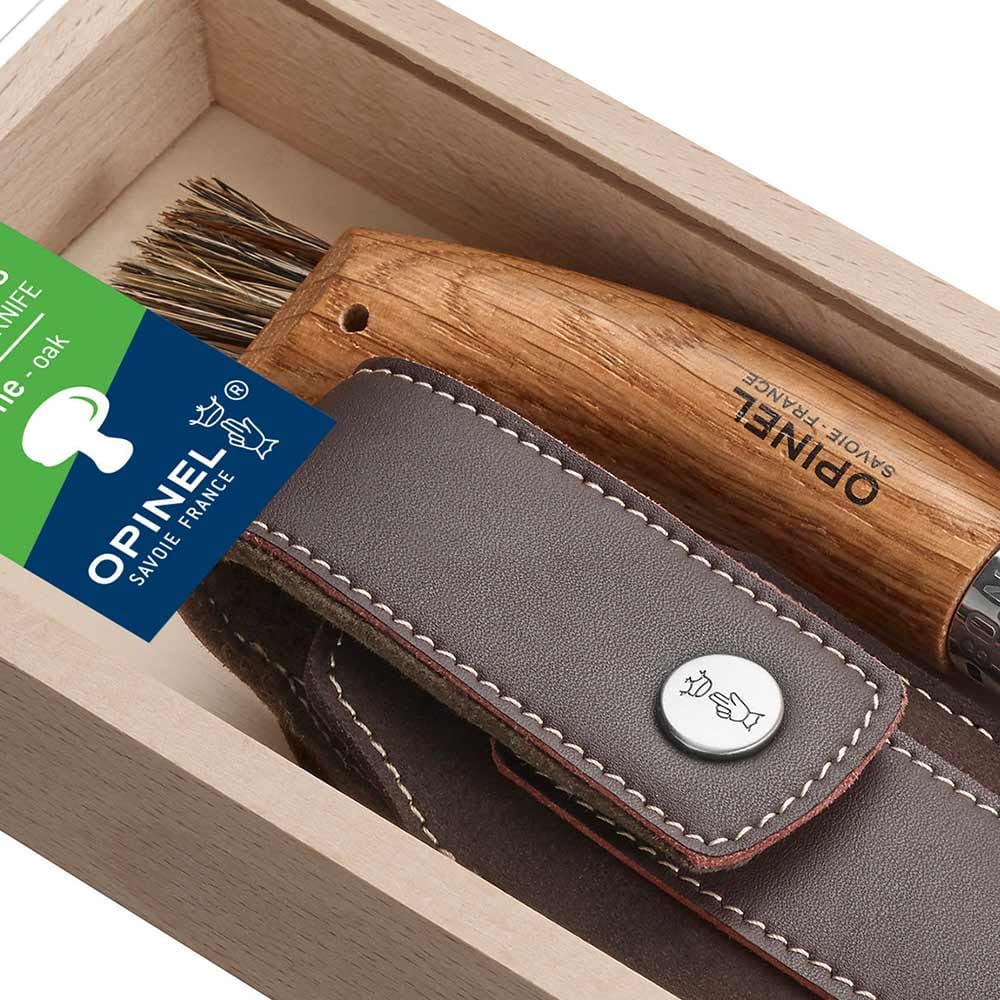 Detail of the wooden handle with the inscription "OPINEL SAVOIE-FRANCE" and leather case with button in the light wooden box