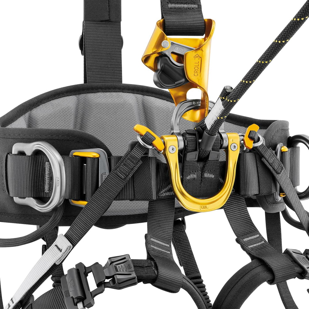 Astro Bod Fast harness by Petzl in close-up with a yellow belay device and a rope passed through the harness