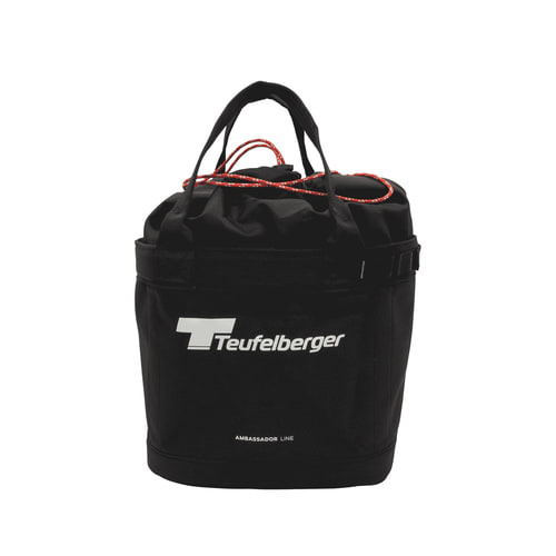 Bucket Mule by Teufelberger, black round bag with two black handles and red cord closure, front with white Teufelberger logo and lettering "AMBASSADOR LINE"