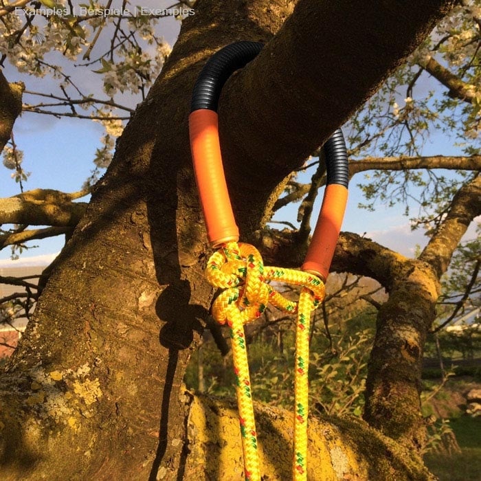 E-Tuber 15 with black and orange part, attached to a tree with yellow and red rope