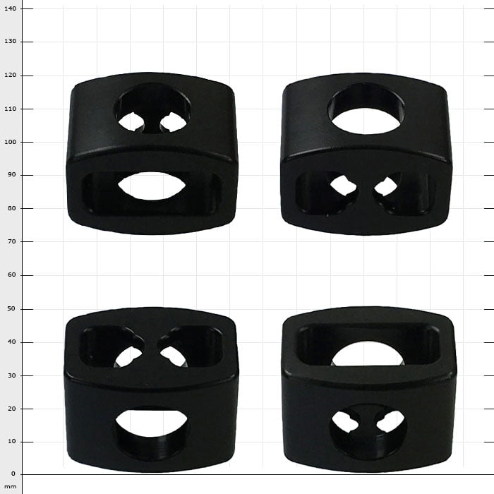 StopperGate black plastic parts with different holes, four pieces on white grid background