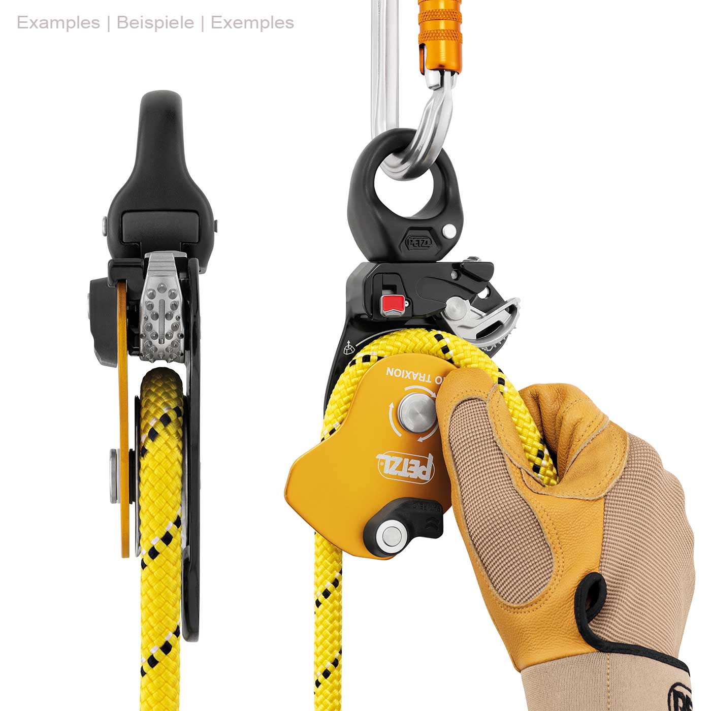 Petzl Pro Traxion Rope Pulley in Yellow and Black with Yellow Rope, Held by One Hand with Work Glove, Attached to the Top with a Silver Snap Hook