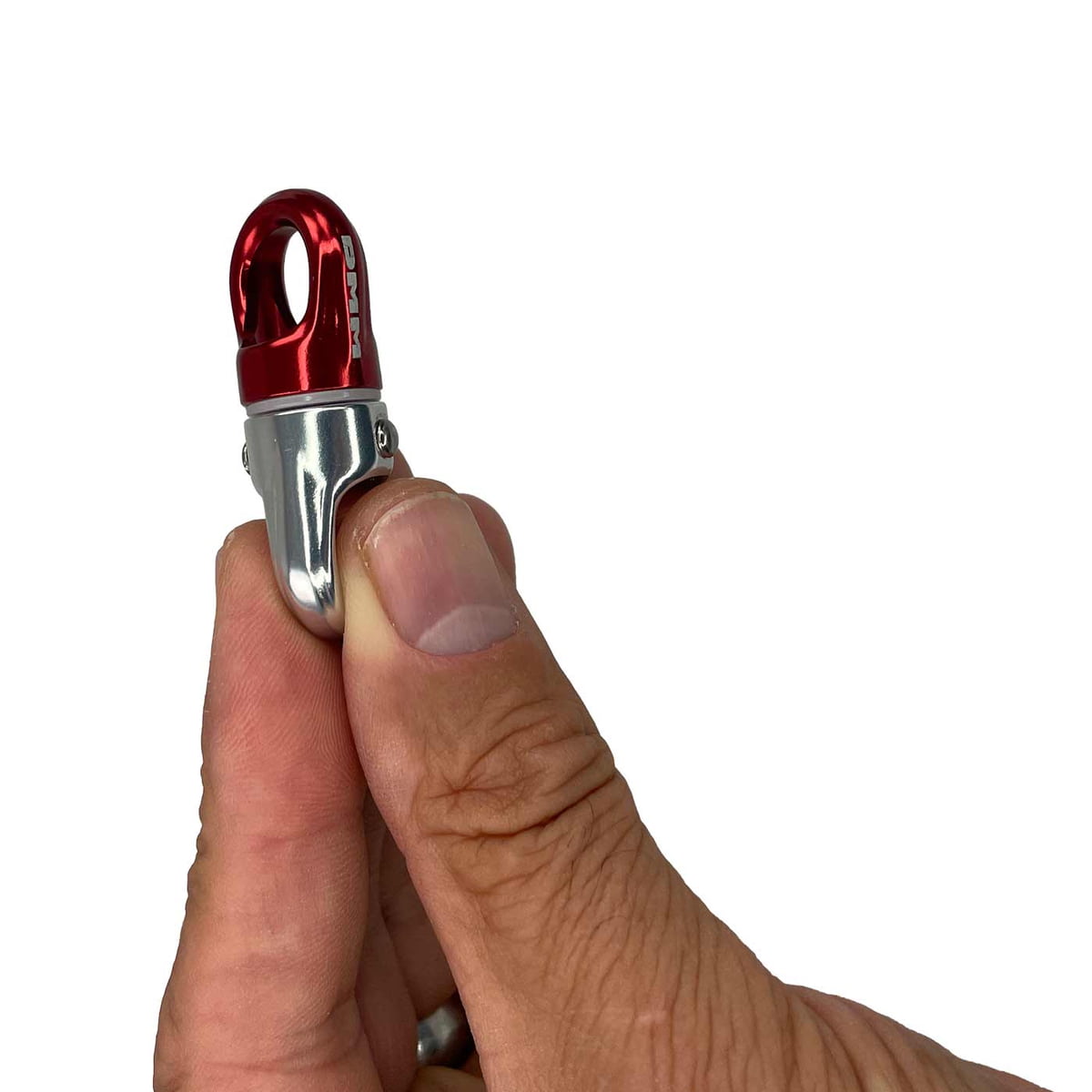XSRE Swivel, red and silver metal swirl held between thumb and index finger, white background