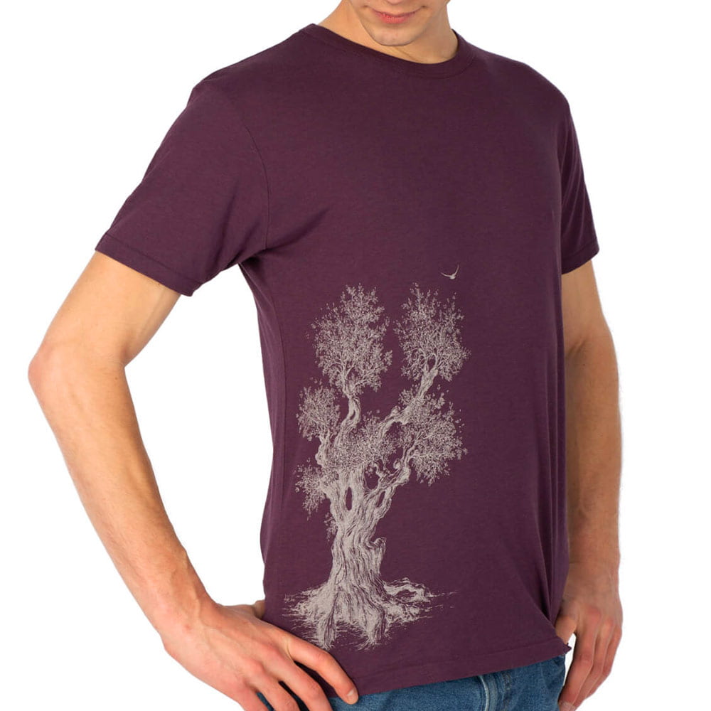 Close-up of a man wearing a purple Olive Tree T-shirt with white tree print, product name Olive Tree T-Shirt