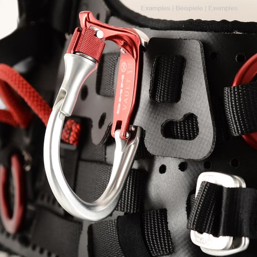 Vault Lock carabiner in silver and red, attached to a black strap system with red and black loops and metal parts