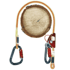 XP-e Complete belay kit with red and yellow rope, snap hook and red belay device placed around a tree trunk