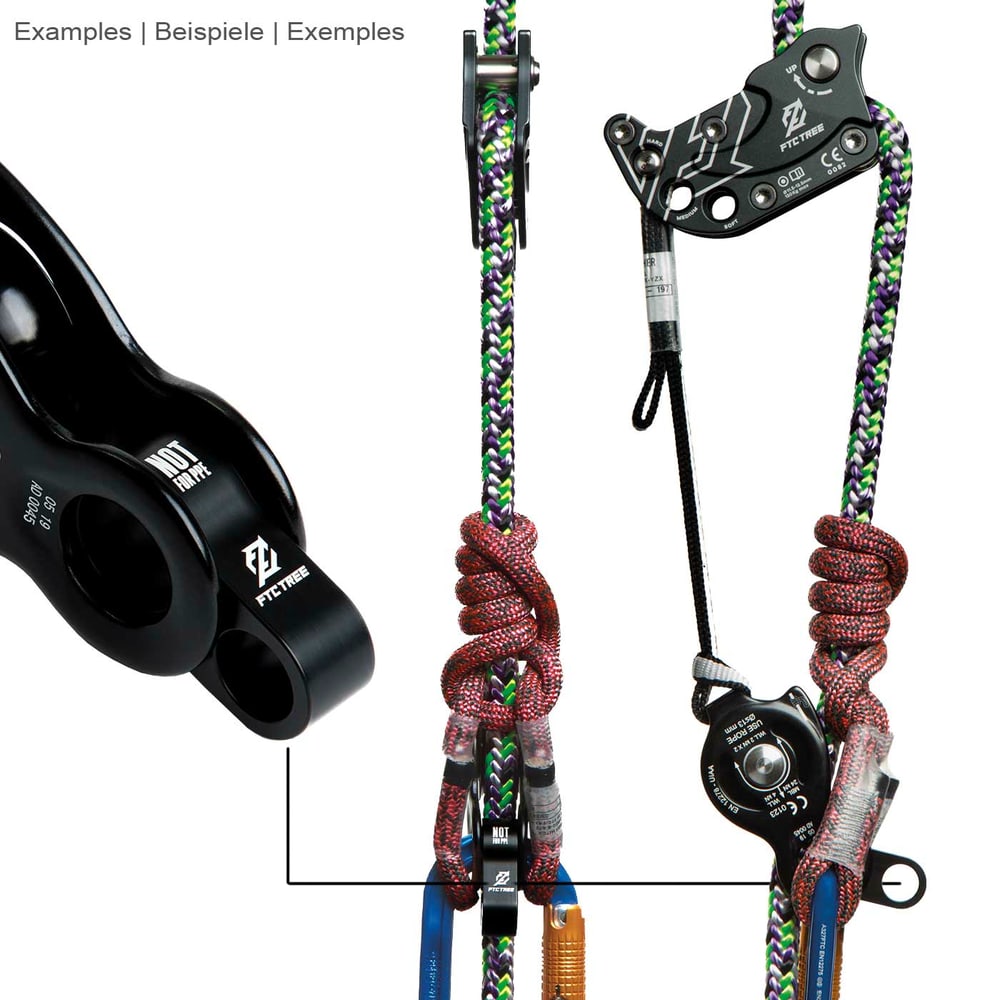 Rise-Up by FTC TREE, black metal part with two round openings, attached to colorful climbing ropes and carabiners