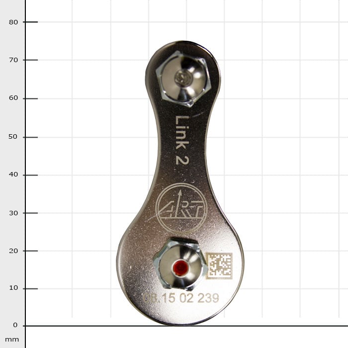 Link 2, silver metal part with two screws and engraved logo