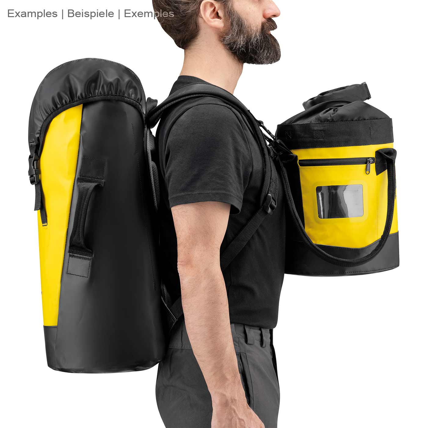 Man carrying the Petzl Transport 30 backpack on his back, the backpack is black and yellow and has padded straps and side handles