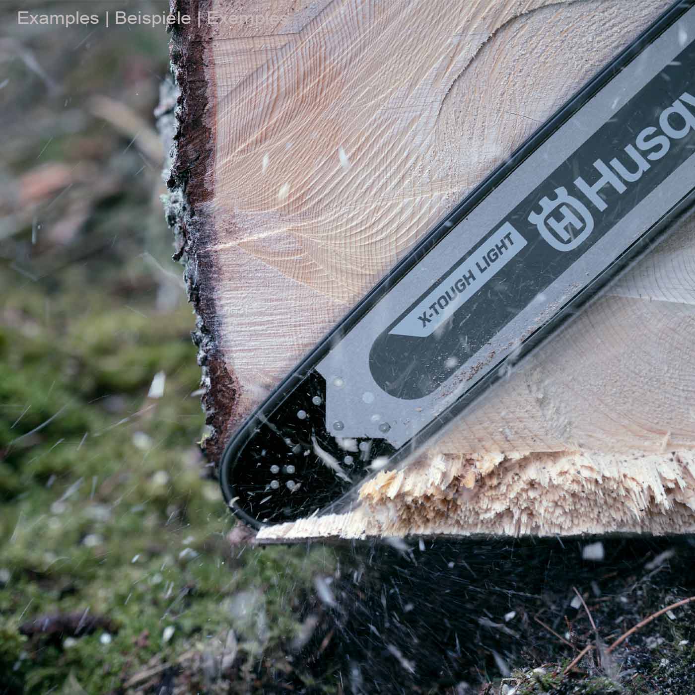 Husqvarna X-Tough Light rail 36 / 3/8 in use when cutting a log, part of the grey rail with black tip and white logo visible