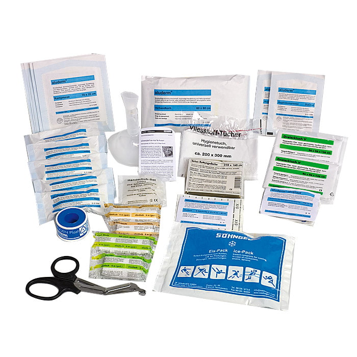Contents of the Klein first aid kit from Söhngen with various bandages, scissors, ice pack and hygiene wipes on a white background