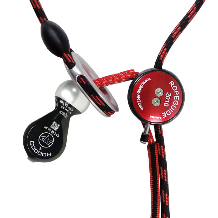 Close-up of the RopeGuide 2010 Cocoon 5 with red round part and black plastic part with Cocoon 5 imprint, manufacturer not visible