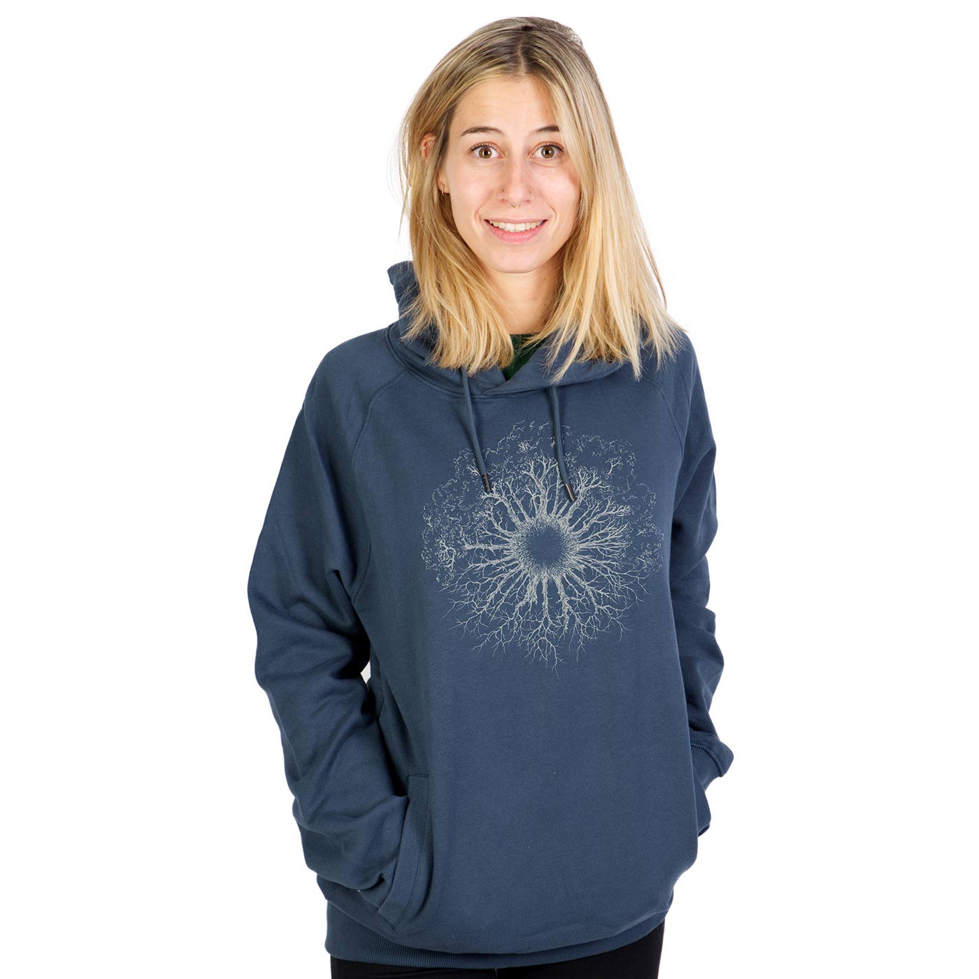 A woman wears a blue Wooden Iris hoodie with a hood and a white, treeroot-like pattern on the chest.