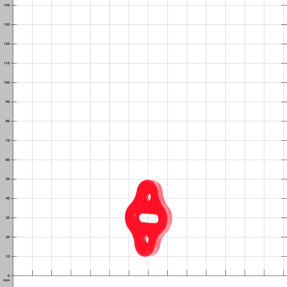 Pinch red plastic part on a white background with a grid in millimeters