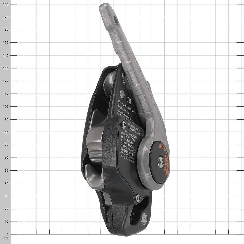 Black device with silver lever, side view with visible texts and symbols, orange and black round element with the inscription "Park Descend"