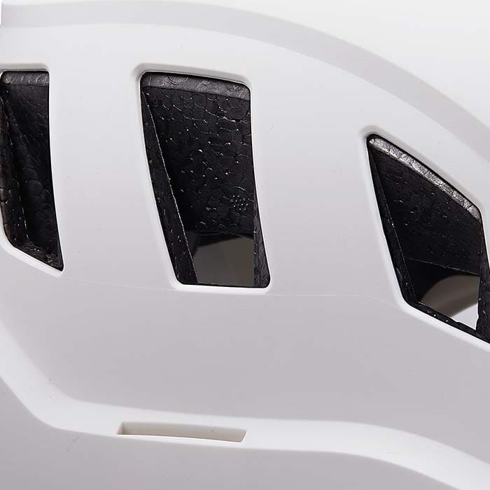 Close-up of the vents of a white PETZL Strato Vent helmet