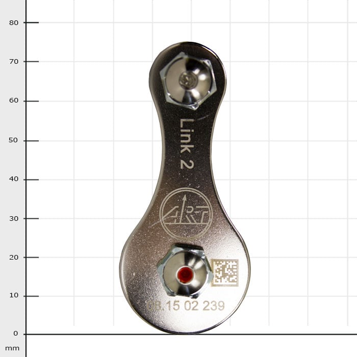 Link 2, silver metal part with two screws and engraved logo