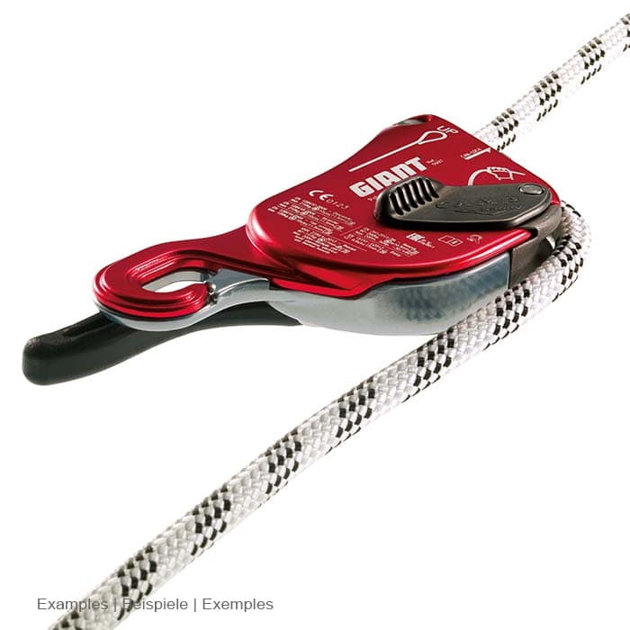 Red climbing device Giant by CAMP with black lever, attached to a white rope, shown lying down, numerous white lettering