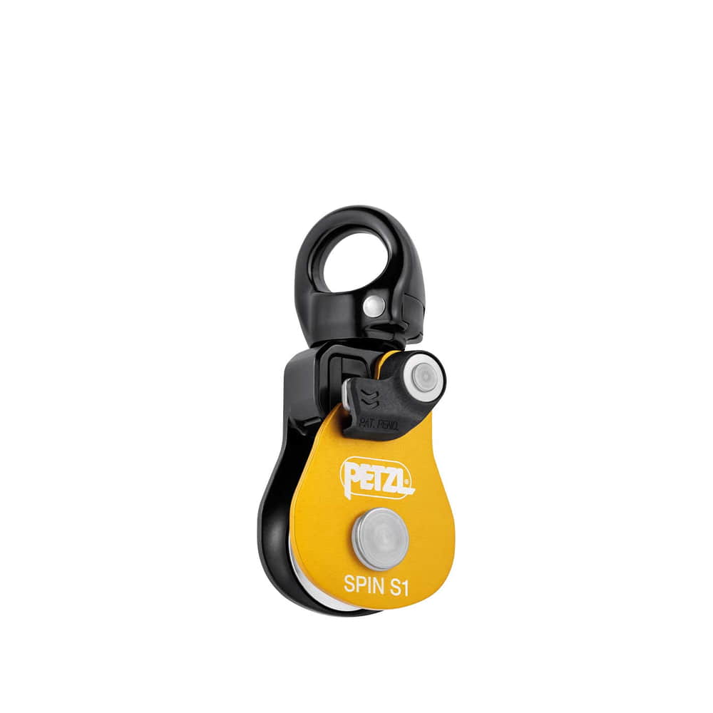 Petzl Spin S1, yellow and black pulley with metal ring on top and white button on yellow plate