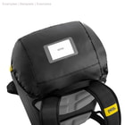 Top view of the Petzl Transport 45 backpack in black with translucent name tag and yellow Petzl logo on the strap