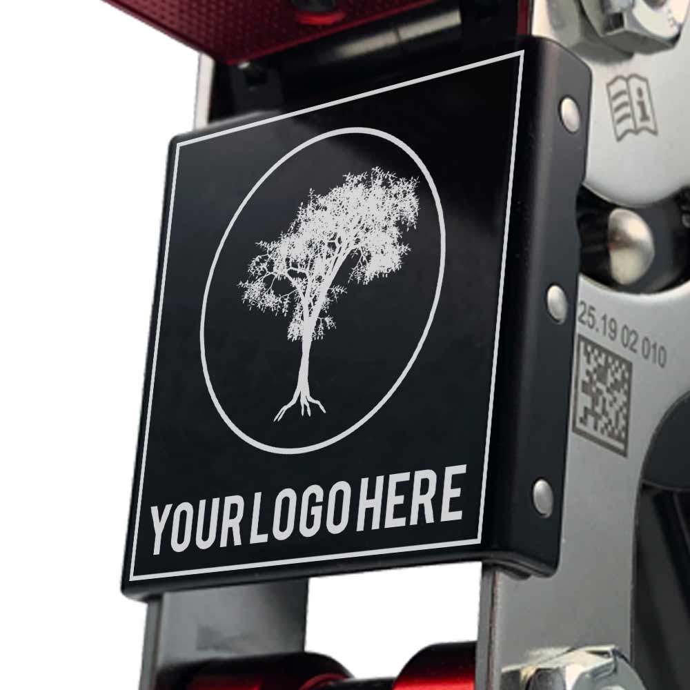 Close-up of the black shield on the SpiderJack 3 with white tree and lettering "YOUR LOGO HERE"