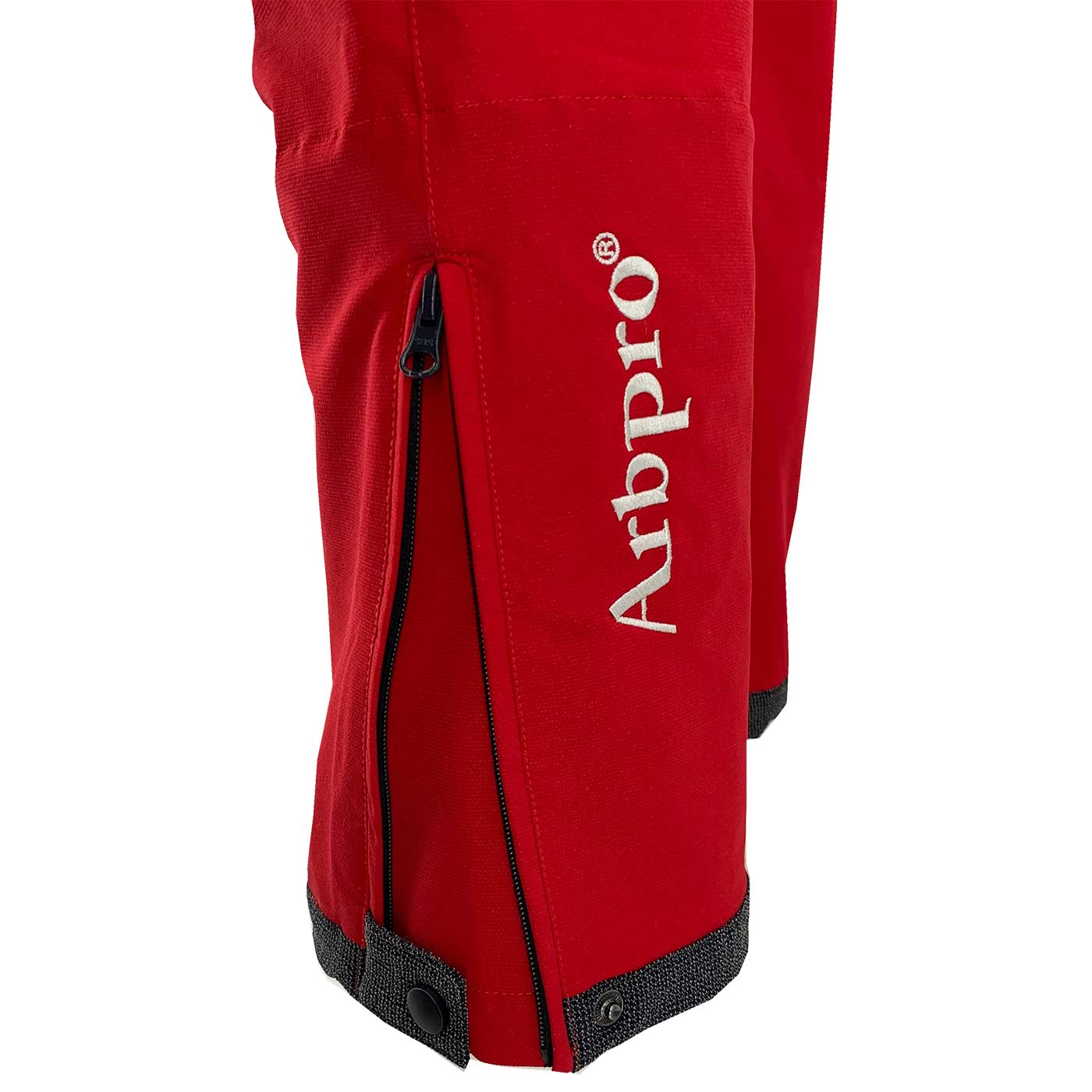 Close-up of Arbpro's red Climb Tech Delta hem with zipper and snap closure