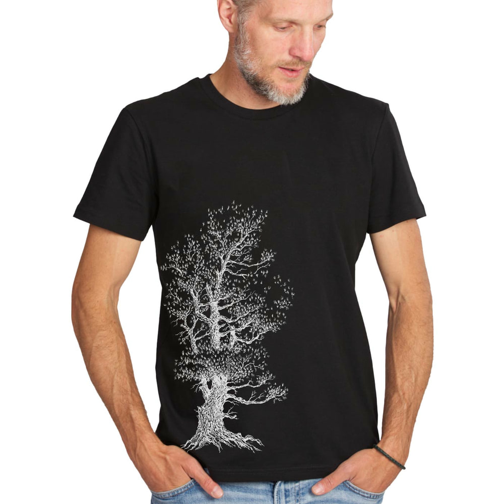 Man wearing Stone Pine Tree T-shirt in black with white tree design, looking to the right