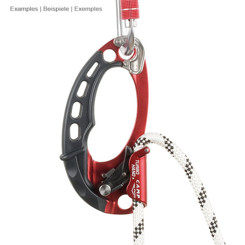 CAMP Turbohand Pro R belay device in red and black hangs from two carabiners and a rope that is passed through the device