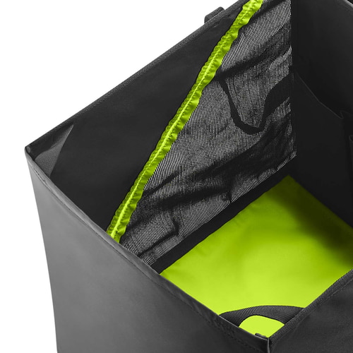 Close-up of the inside of the black and green bag with mesh fabric and green accents
