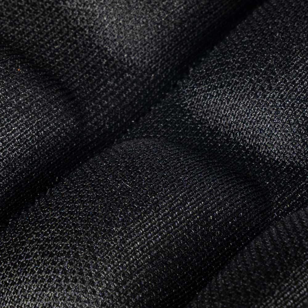 Thistle upholstery Velcro close-up of a black textured Velcro closure with padded textile