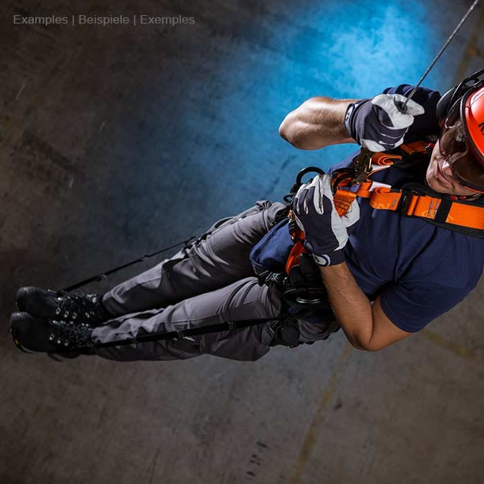 Relief Straps, Person in Safety Helmet and Gloves Wearing Orange Seat Belt While Abseiling in Dark Environment