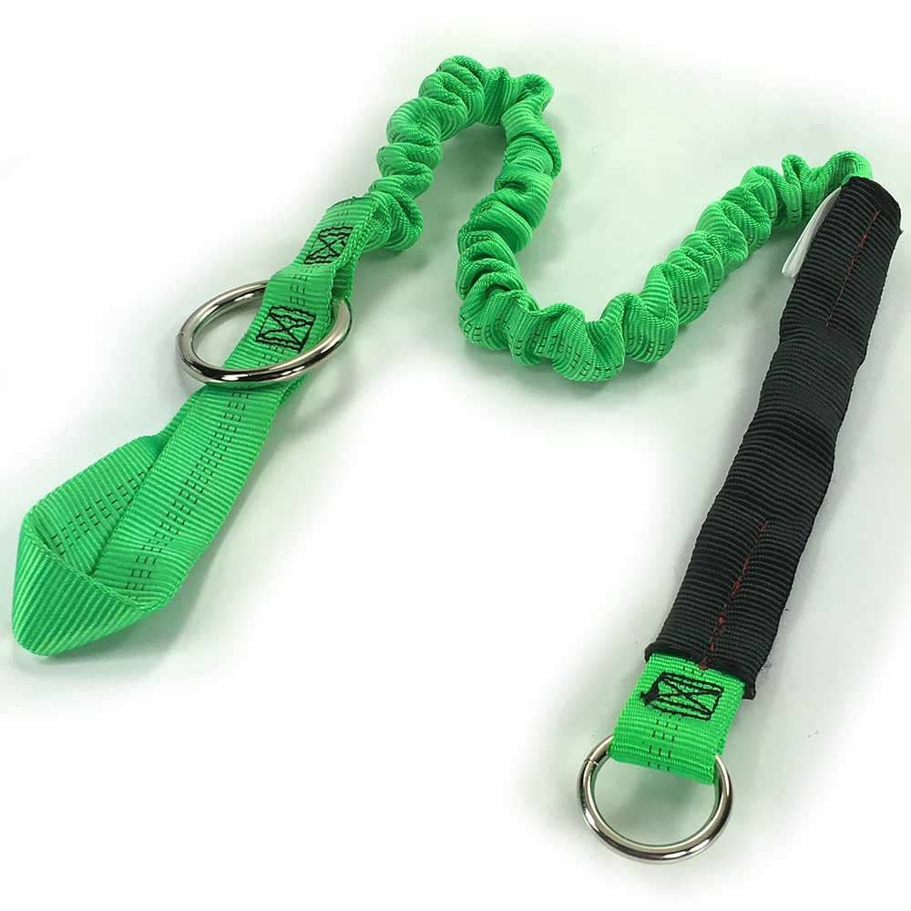 Strop 50, green elastic band with two metal rings, one end with black reinforcement, lying on a white background