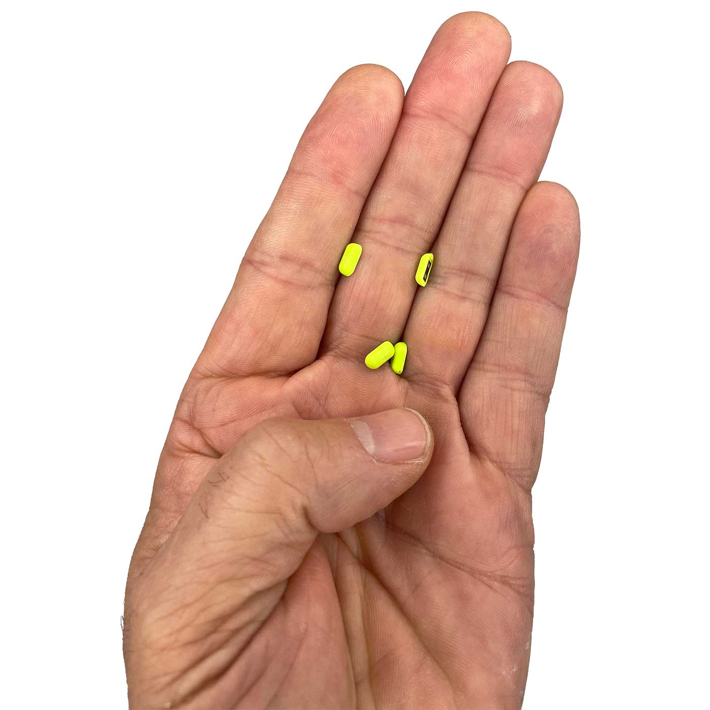 Hardware NFC tag from Scannable, three small yellow-green NFC tags on the palm of a person's hand